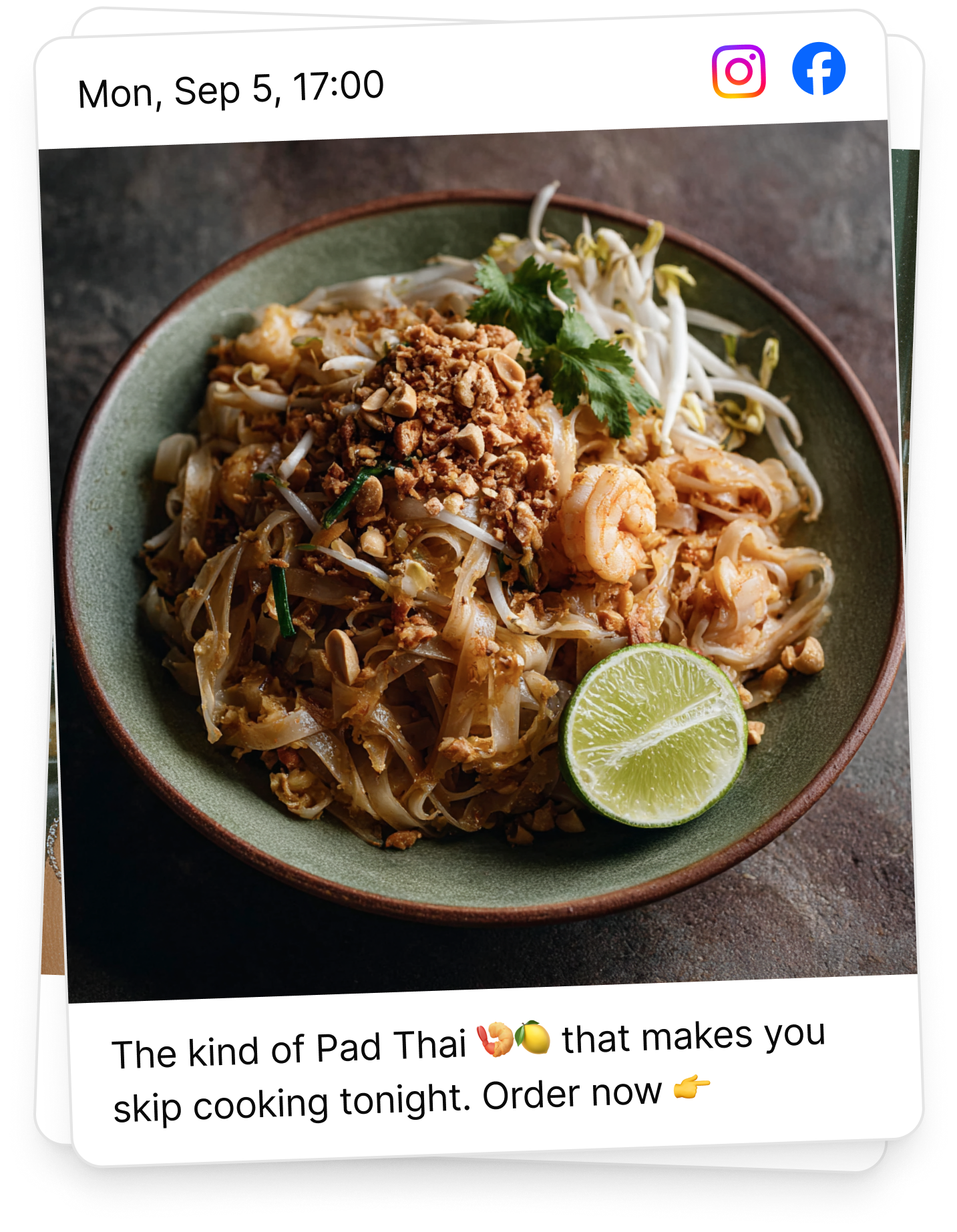 A bowl of Pad Thai with shrimp, bean sprouts, crushed peanuts, and a lime wedge, garnished with cilantro.